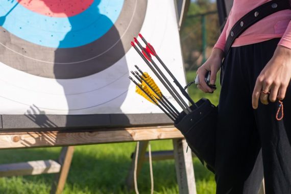 A close-up view of an archery target and arrows in a quiver outdoors in Portugal.